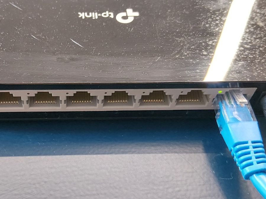 Network switch with an ethernet cable plugged in – internet and WiFi repair Christchurch