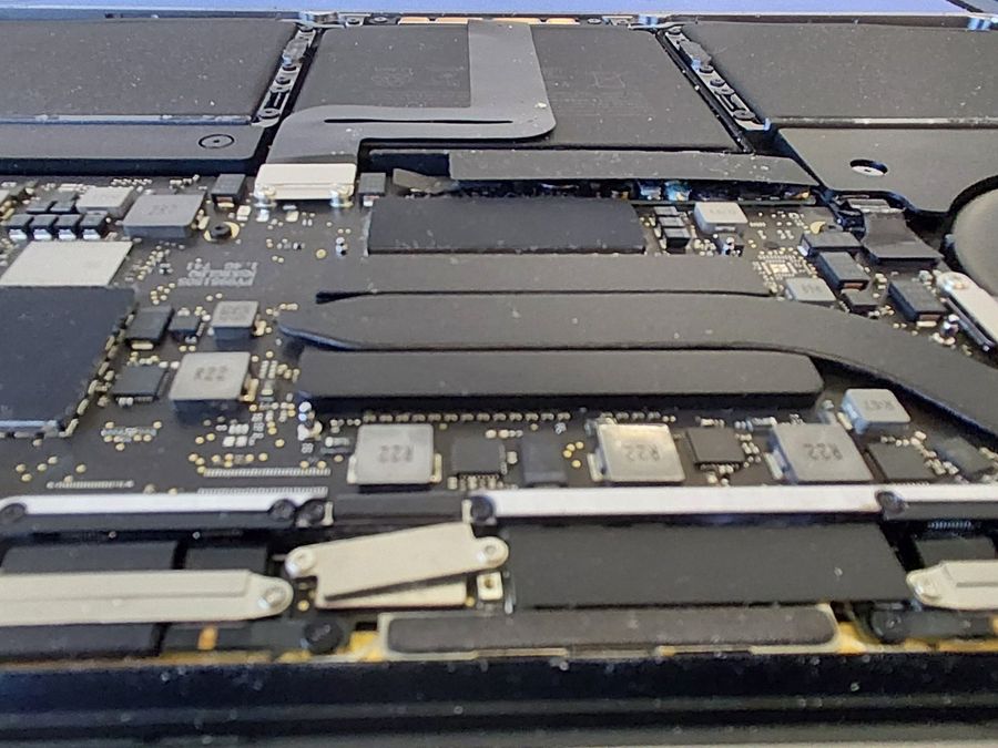 Close-up of a MacBook Pro logic board and heat pipe during a repair – Mac repair Christchurch